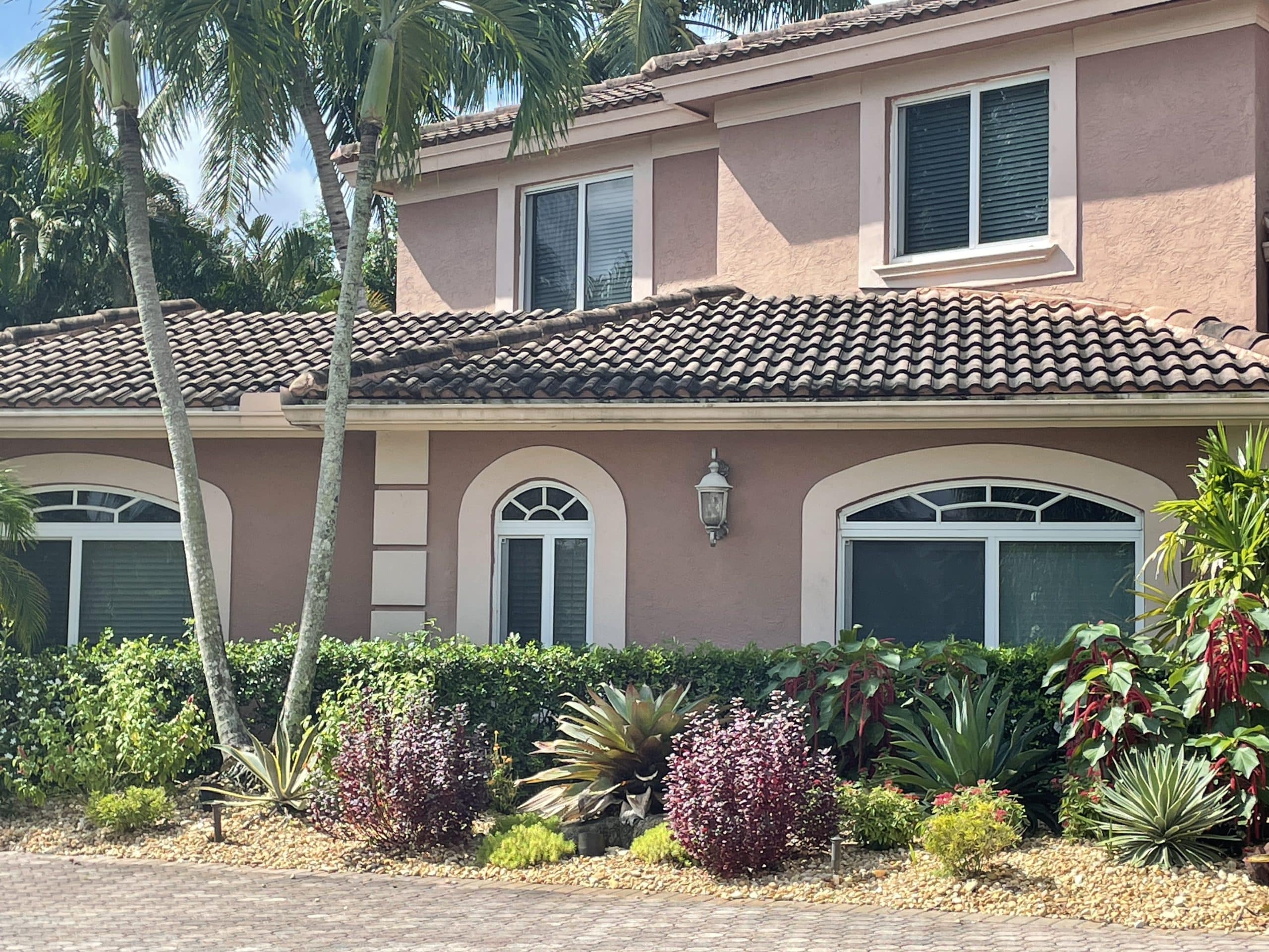 White-framed impact windows on a South Florida home